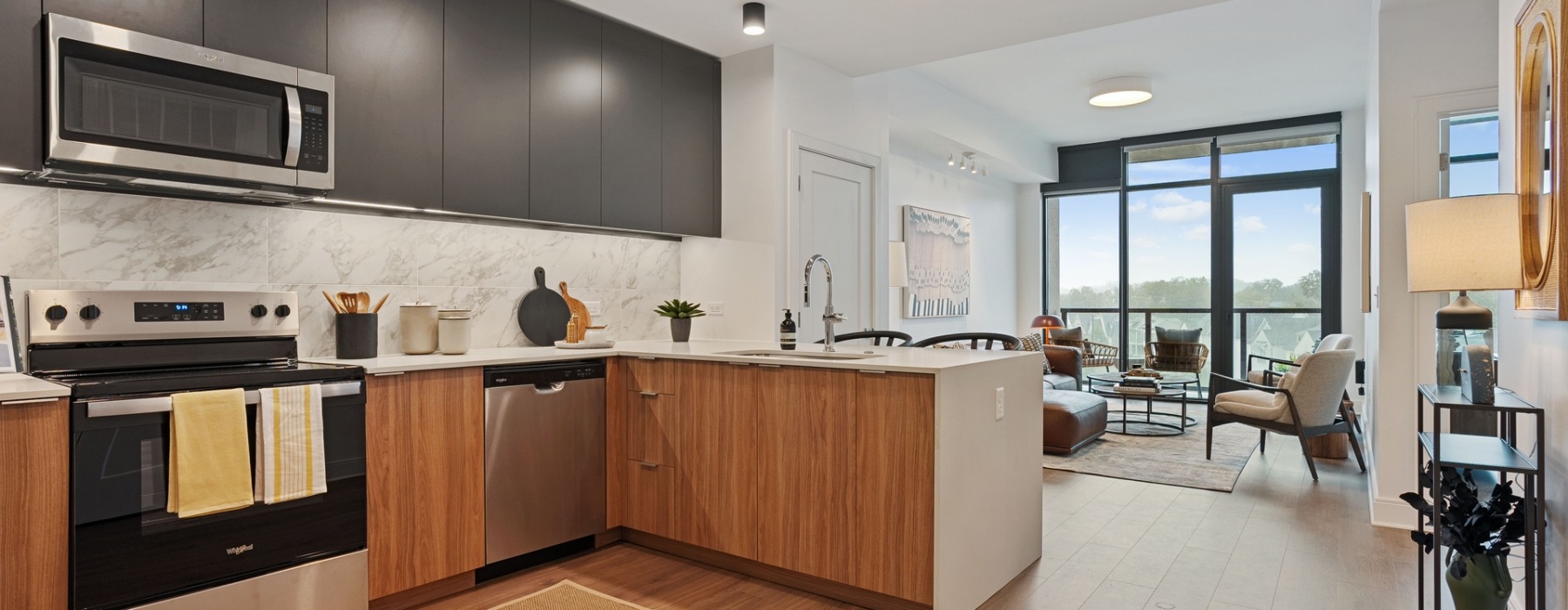 an apartment kitchen and living room