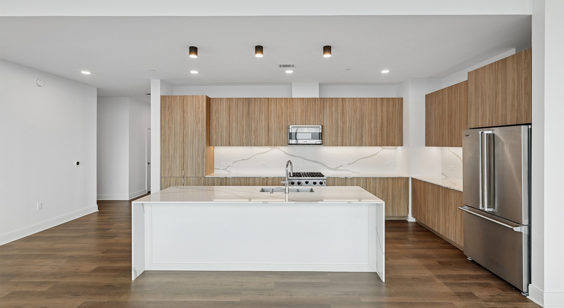 a kitchen with a prep island