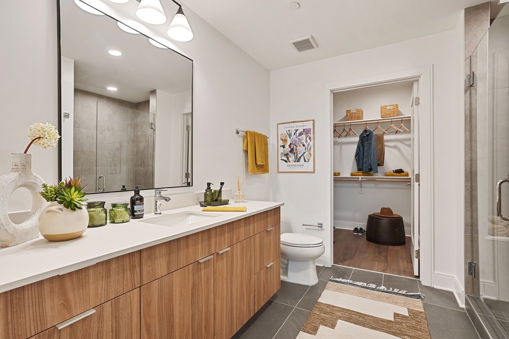 Spacious bathrooms with everything you need brightly lit bathroom with walk-in closet