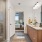 sink counter in bathroom with ample lighting