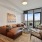 spacious living room with access to private balcony