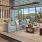 room with couches, chairs and large window